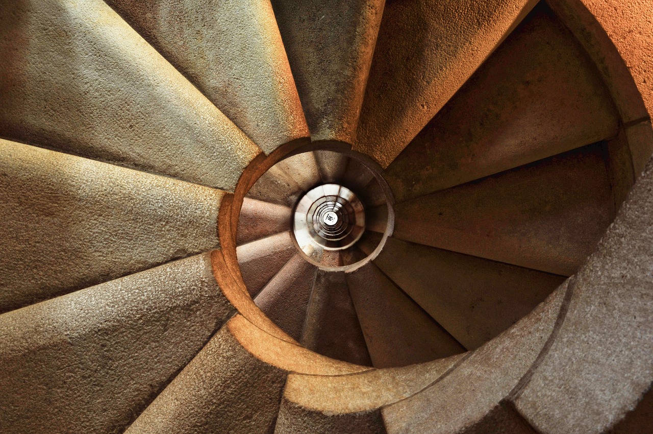 Elegant chandelier illuminating contemporary staircase design. Elegant chandelier illuminating contemporary staircase design.