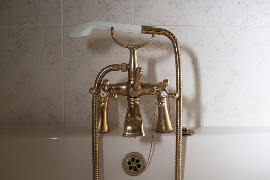 Brass light fixtures against marble walls. Brass light fixtures against marble walls.