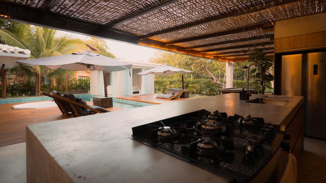 Colorful terrazzo countertops in bright summer kitchen.