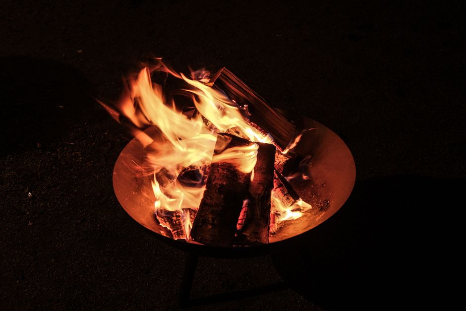 Friends enjoying a cozy evening by the fire. Friends enjoying a cozy evening by the fire.