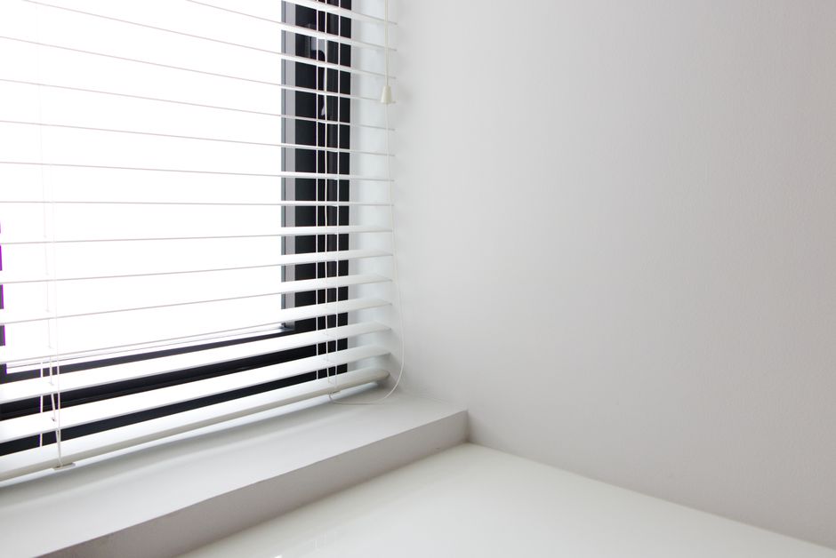 Elegant pleated shades in a minimalist kitchen Elegant pleated shades in a minimalist kitchen