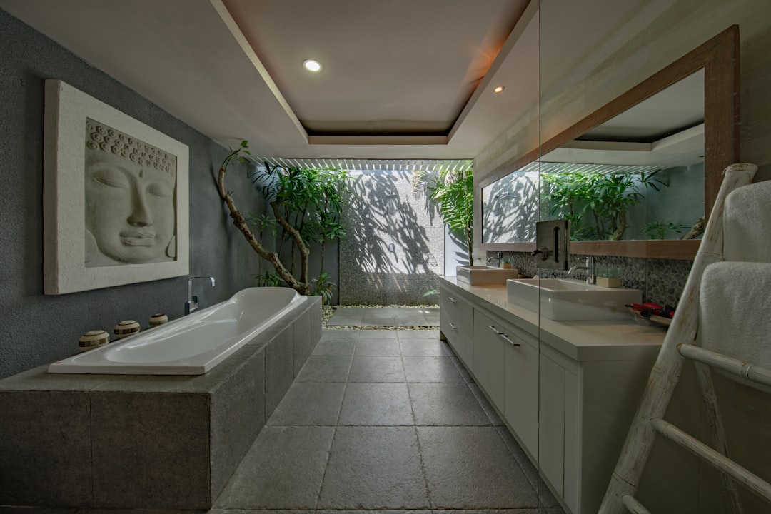 Luxurious tropical rain shower with lush plants.