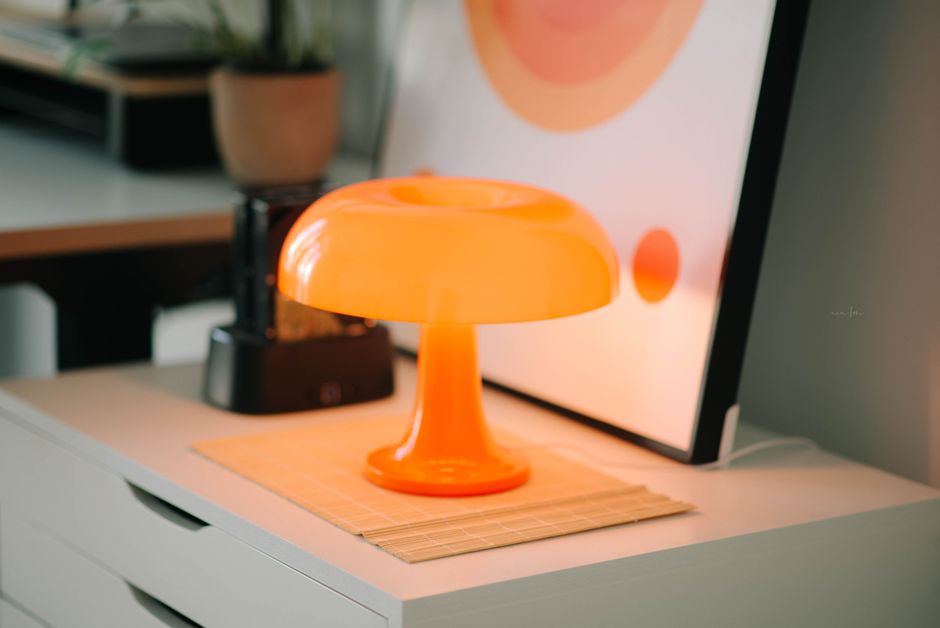 Bright orange cushions accenting a neutral interior.