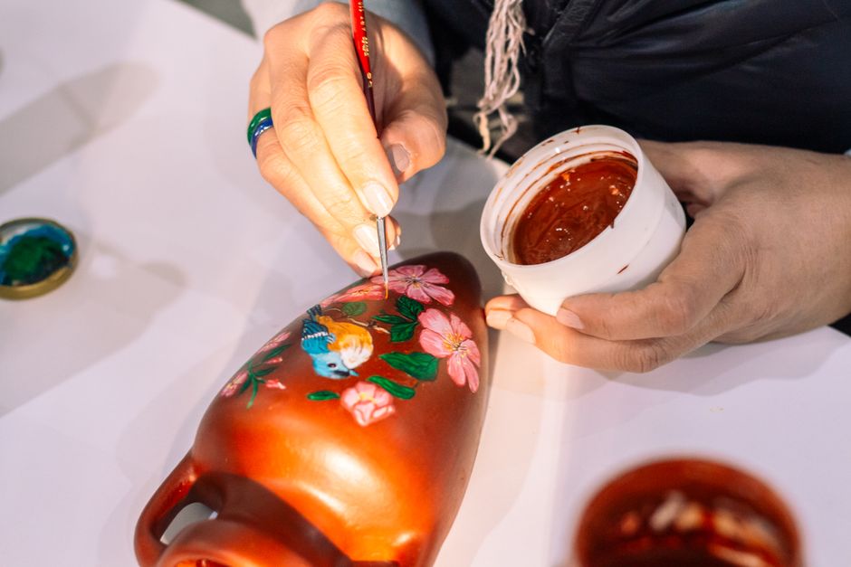 Handcrafted vases with intricate fall designs. Handcrafted vases with intricate fall designs.