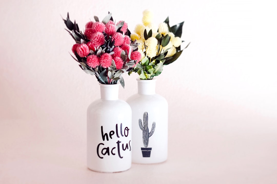 Colorful hand-painted vases on rustic table. Colorful hand-painted vases on rustic table.