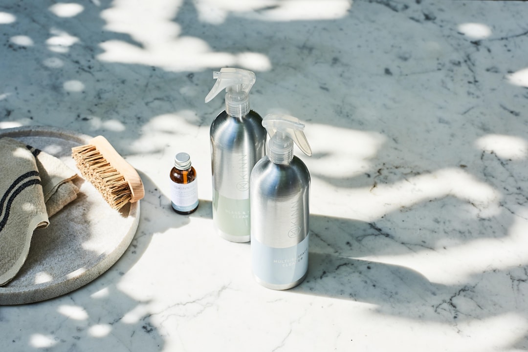 Homemade citrus cleaner with autumn leaves. Homemade citrus cleaner with autumn leaves.