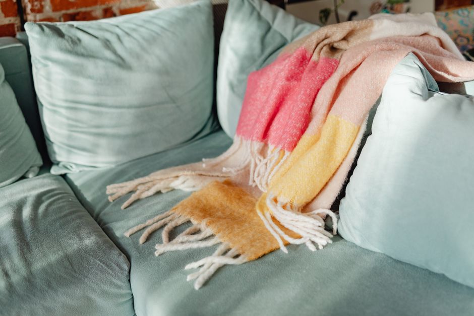 Warm-toned cushions accenting a comfy armchair. Warm-toned cushions accenting a comfy armchair.